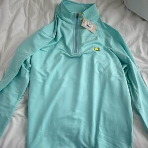 Peter Millar Masters quarter- zip pullover. Light blue with yellow logo